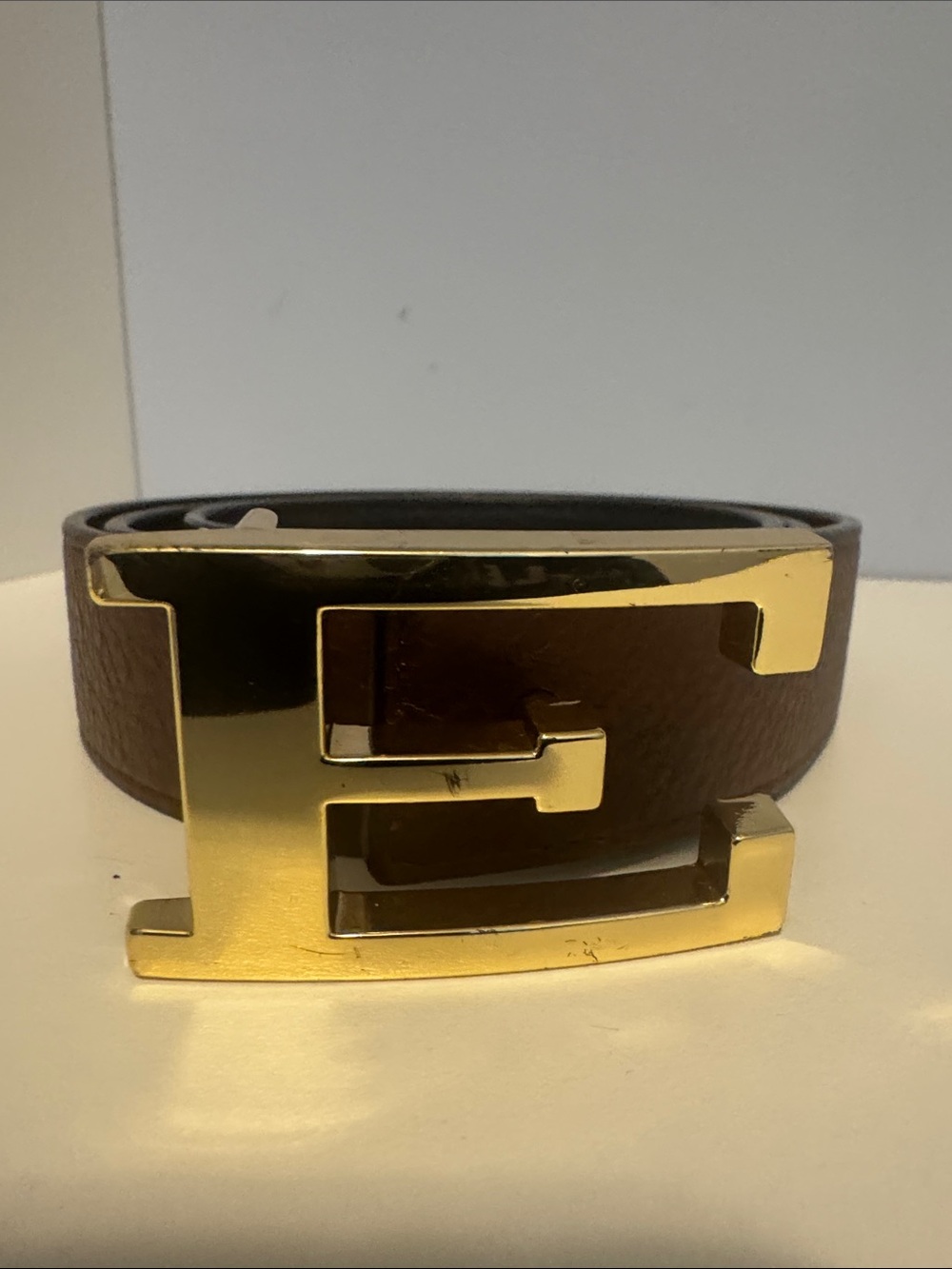 C. Wonder Double-Sided Reversible Leather Belt with Signature Gold “E” Buckle